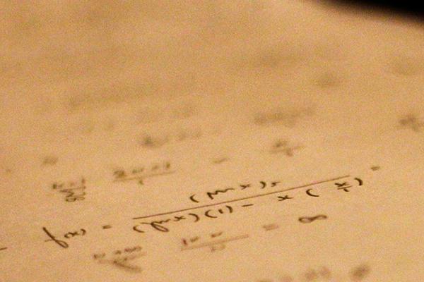 Math formulas written on a piece of paper